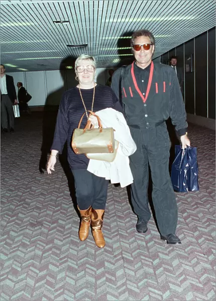 Singer Tom Jones and his wife Linda at Heathrow Airport. 16th May 1992