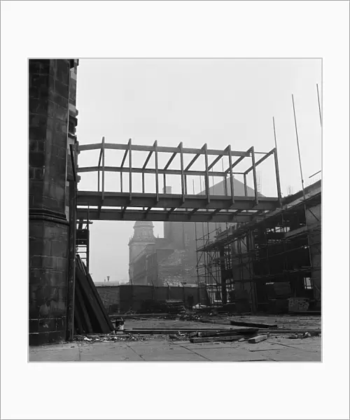 Bridge lifted into position to join old and new town hall. Circa 1971
