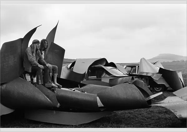 Isle of Wight Festival. Two Swedish hippy types sitting on top of cars that look like