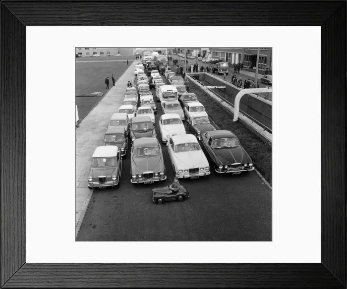 Framed Print : Print of a 1967 photograph showing Patrick Edwards in the smallest BMC car Framed Print : Print of a 1967 photograph showing Patrick Edwards in the smallest BMC car