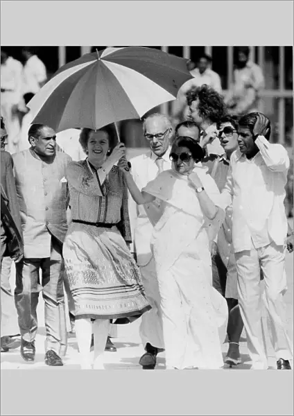 Margaret Thatcher and Indira Ghandi walking in India beneath umbrella - 19th April 1981