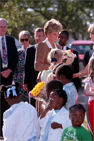 PRINCESS OF WALES GREETING PEOPLE DURING A VISIT TO CHARITY PROJECTS IN ZIMBABWE - JULY