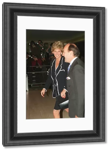 PRINCESS DIANA, SMILING, AND AN UNKNOWN MAN ARRIVE AT A FUNCTION - 05  /  06  /  1995