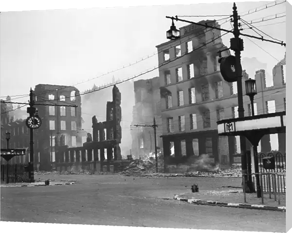 Damage to a bus station and surrounding buildings after an air raid in Manchester