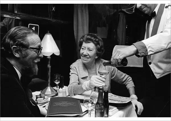 Dame Flora Robson March 1972 drink a toast to old times as the Brighton Belle train
