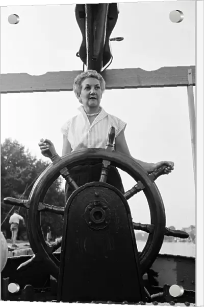 Mrs Tepper on her boat Cornelia at Kingston Bridge, London. 31st August 1955