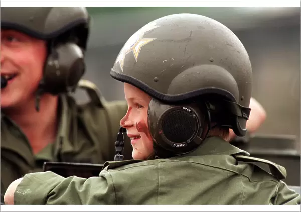 PRINCE HARRY IN UNIFORM IN A TANK VISITING THE LIGHT DRAGOON BARRACKS IN GERMANY