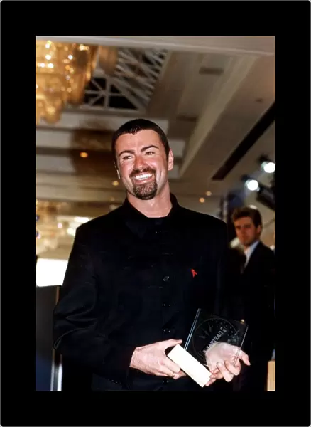 GEORGE MICHAEL, SINGER WITH HIS CAPITAL RADIO AWARD FOR BEST MALE SINGER 1995