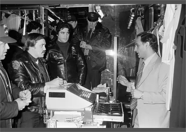 New York Police question a man in a shop. 13th February 1981