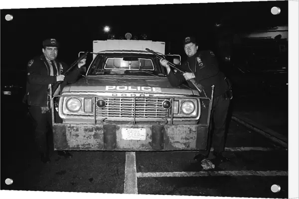 Two New York Policemen in front of their truck. 13th February 1981