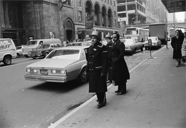 Doormen hailing a cab in New York, 13th February 1981