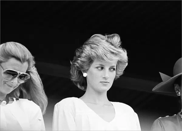 Diana, Princess of Wales watches her husband playing in a polo match at Palm Beach