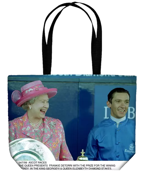 Queen Elizabeth presents Frankie Dettori with the prize for the winning jockey in