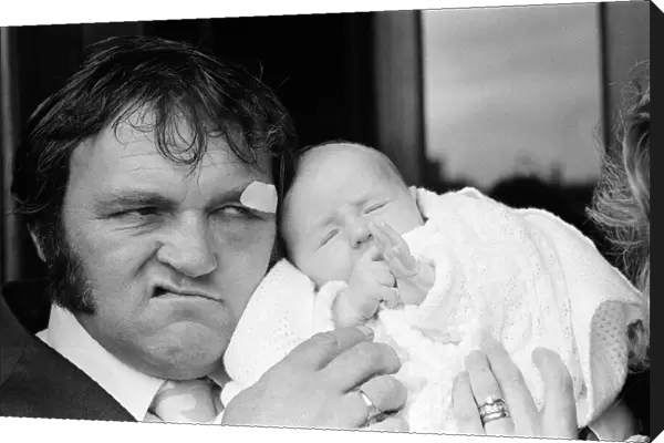 Les Dawson with his baby daughter Pamela Jane at her christening at Cleveleys, Lancashire