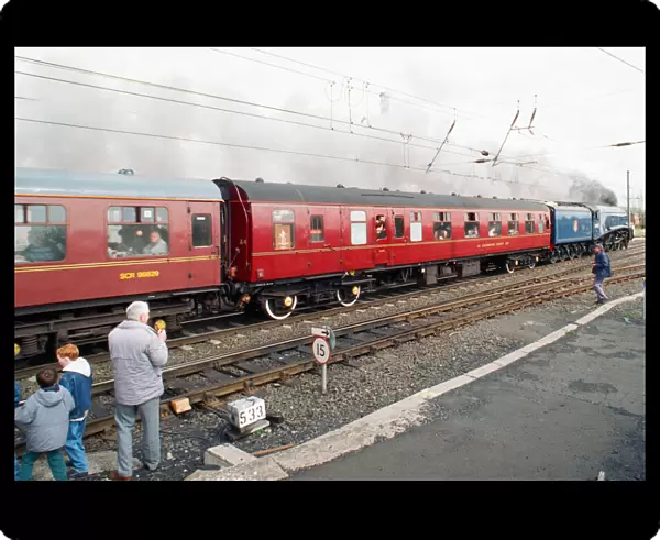 The A4 locomotive Sir Nigel Gresley powers its way through Morpeth Station as it