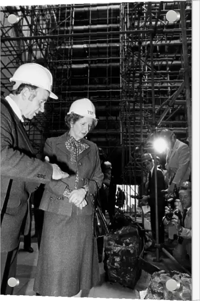 Margaret Thatcher wearing hard hat during visit to York Minster after storm damage