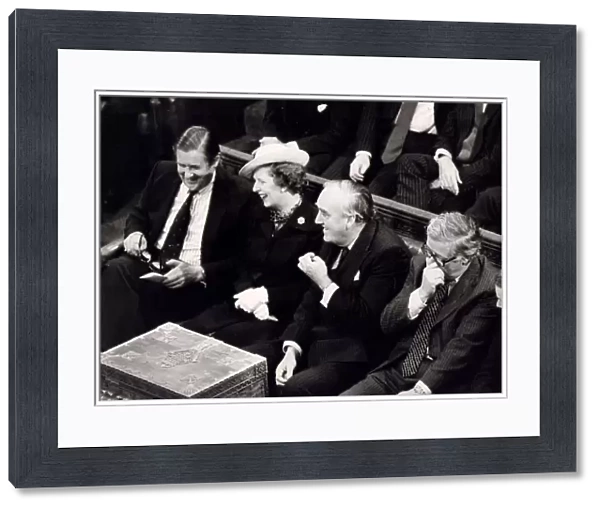 Margaret Thatcher with William Whitelaw and Sir Geoffrey Howe laughing on front bench in