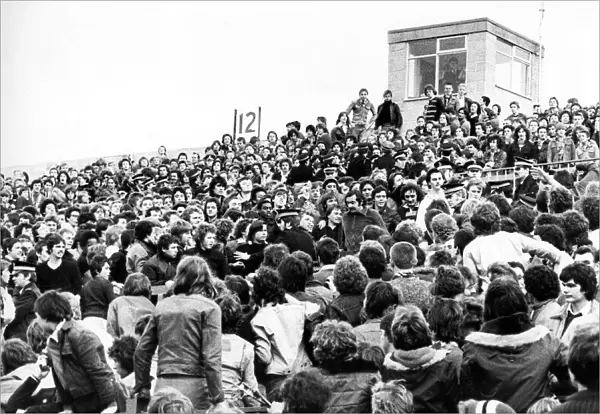 Crowds of football fans being controlled by police in 1978