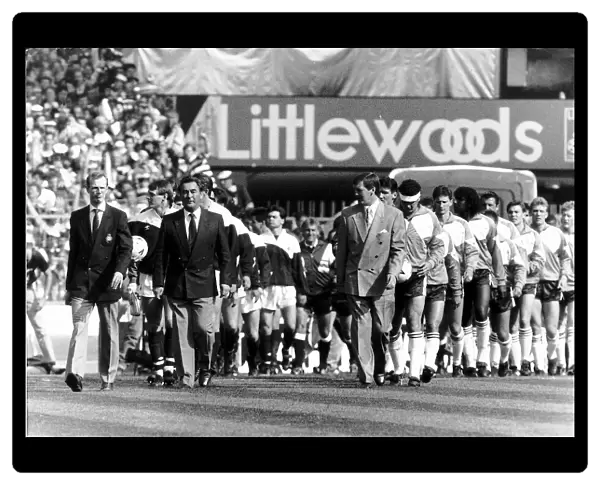 Brian Clough Nottingham Forest Football Manager, leading his team on to pitch along side