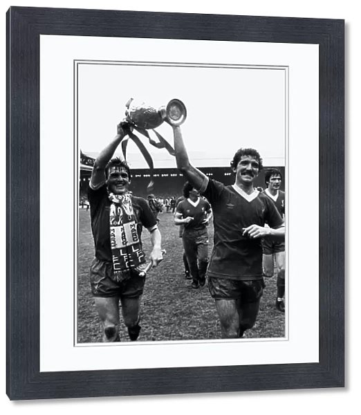 Kenny Dalglish with Graeme Souness proudly holding aloft League Championship trophy at