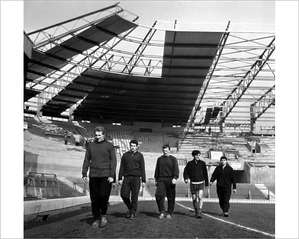 Manchester United Football Players training under the new cantilever stand at Old