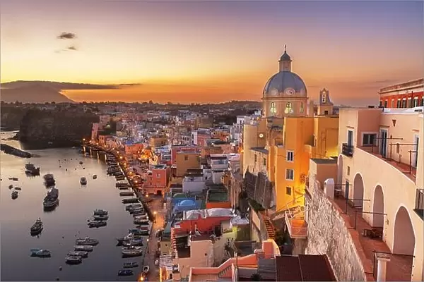 Procida, Italy old town skyline in the Mediterranean Sea during dusk