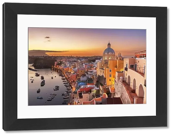 Procida, Italy old town skyline in the Mediterranean Sea during dusk