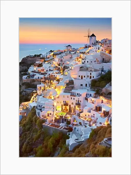 Cityscape sunset view of Oia Town, Santorini Island, Cyclades, Greece