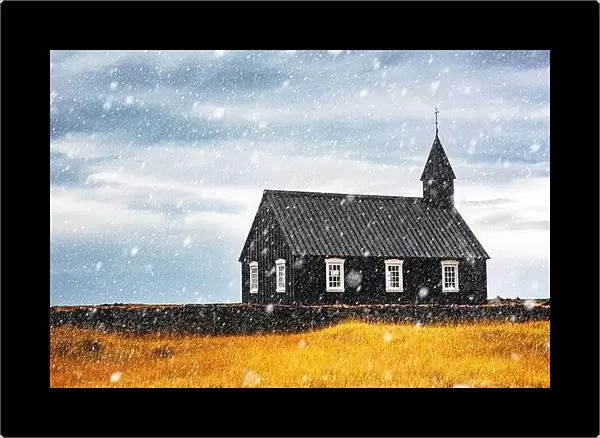 Autumn landscape with snowy famous picturesque black church of Budir at Snaefellsnes peninsula region in Iceland