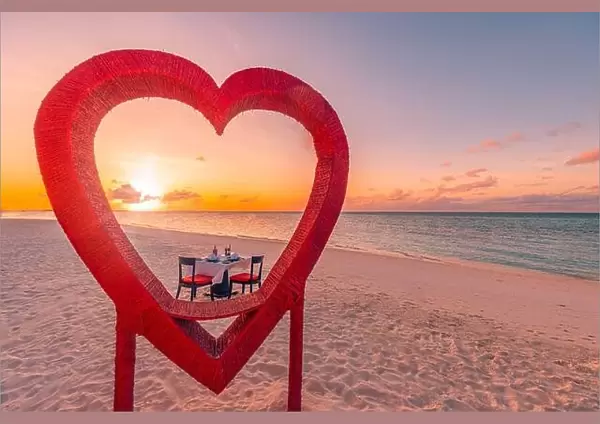 Honeymoon couples dinner at private luxury romantic dinner on tropical beach in Maldives. Seaside sea view, amazing island shore with red heart shape