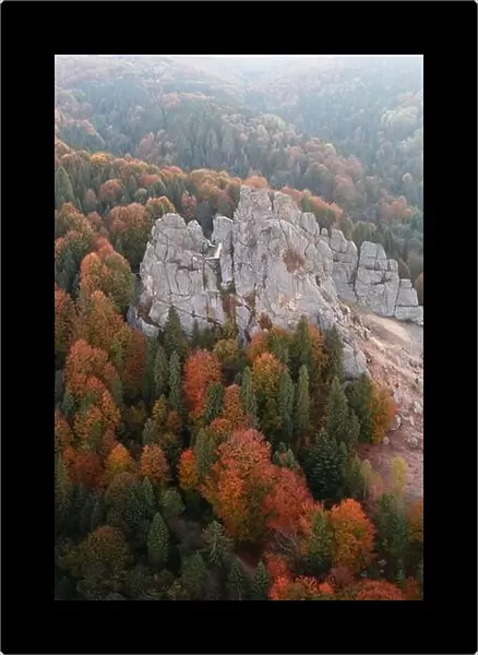 Aerial view from drone to Tustan fortress - archeological and natural monument of national significance in Urych village in autumn time, Ukraine