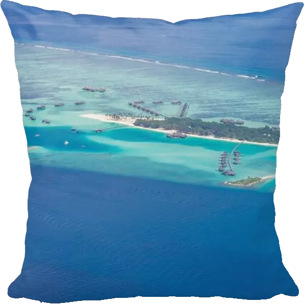 Amazing aerial view of Maldives island and beach. Drone or airplane view of atoll and island and sea
