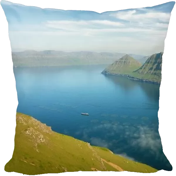 Fish farm with ship on foggy fjords of Funningur, Eysturoy island, Faroe Islands. Landscape photography