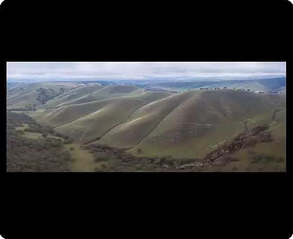 Clouds drift across peaceful green hills and valleys in the tri-valley area in Northern California