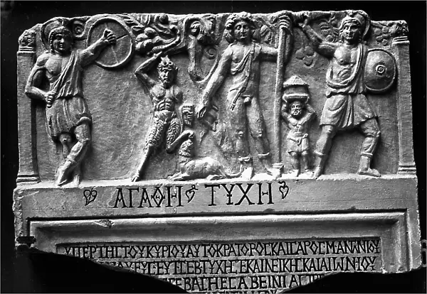 Votive relief dedicated to Dionysus discovered at Torni on the Red Sea and in the National Museum of Berlin. It was at the Augustan Exhibition in Rome in 1938