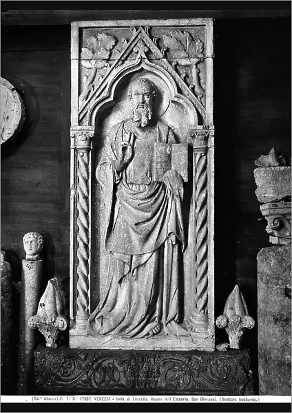 Carved aedicule with St. John the Evangelist in the act of blessing, from the Venetian-Tuscan School, displayed in the Museo dell'Estuario, Torcello