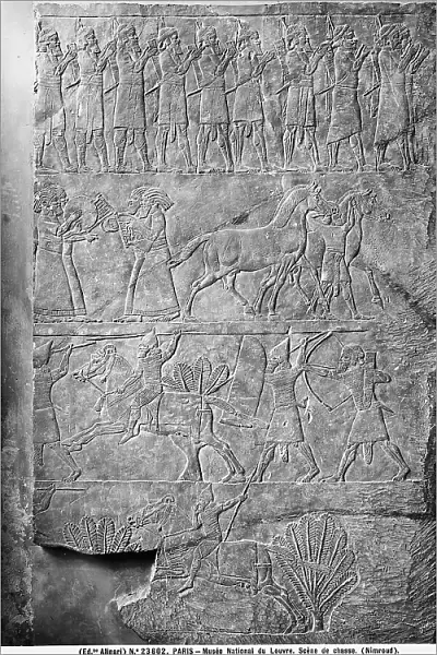 Carved stone with hunting scenes taken from Nimrud: work preserved in the Louvre Museum, Paris