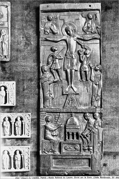 Ivory plaque with a representation of the Crucifixion, under the Cross are the Madonna and St. John the Evangelist. Italian work of art from the XI century preserved at the Louvre Museum, Paris