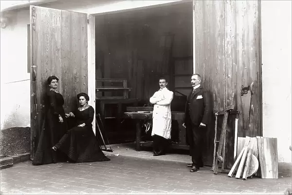 Group portrait in front of a joiner's shop