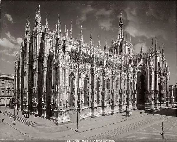 View of the facade and side of the Cathedral in Milan