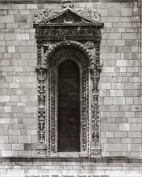 Detail of a window on the left side of Como's Cathedral