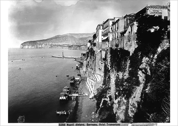 Seascape of the gulf of Sorrento (Naples). View of a high promontory dropping sheer to the sea; the Hotel Tramontano is visible in the foreground
