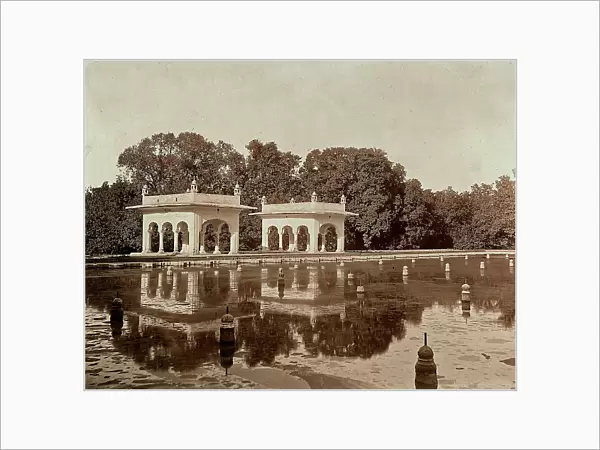 Two pavillions located on the margins of a large basin in a park in Lahore, Pakistan