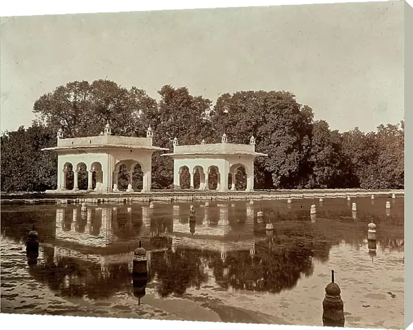 Two pavillions located on the margins of a large basin in a park in Lahore, Pakistan