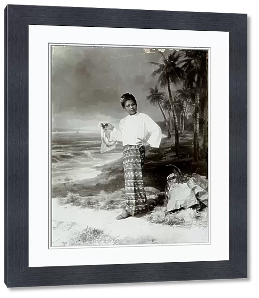 On the seashore, a thai girl photographed in a typical Siam costume