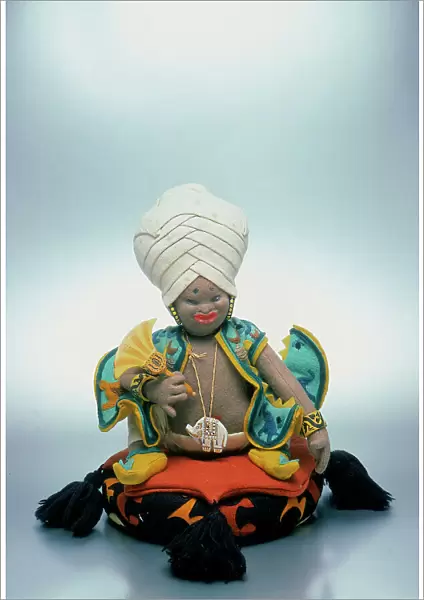 Cloth doll made in the 1920s by the well-known Lenci firm. The doll represents an Indian prince with a tall turban, seated on a soft colored cushion