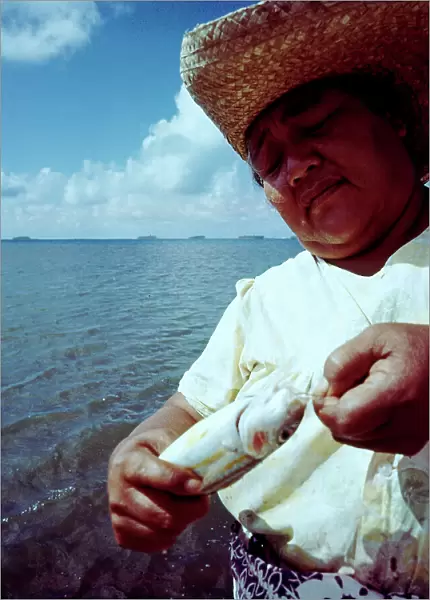 Society Islands. Leeward Islands. Raiatea. Female angler