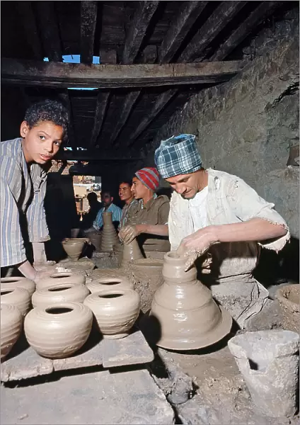 Upper Egypt: in a village along the banks of the Nile workers work the clay into a small factory