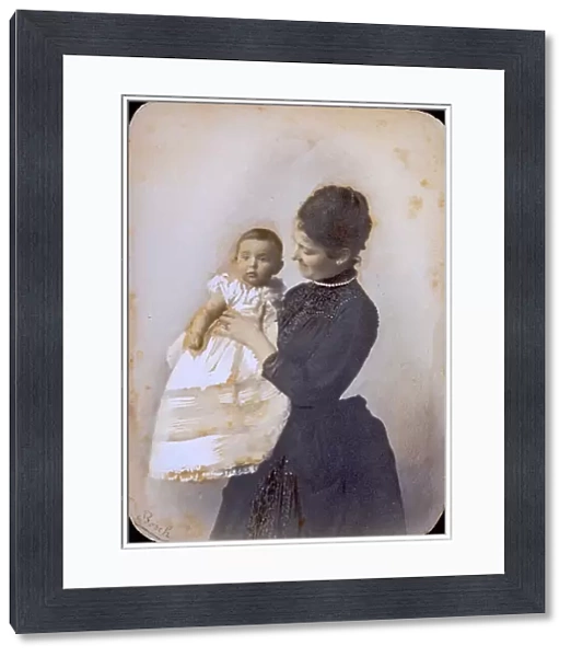 Portrait of a lady holding her baby boy
