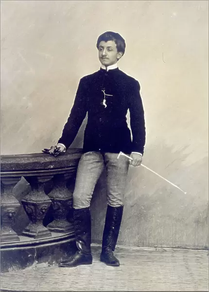 Full-length portrait of a young person in a riding outfit, carrying a whip and gloves